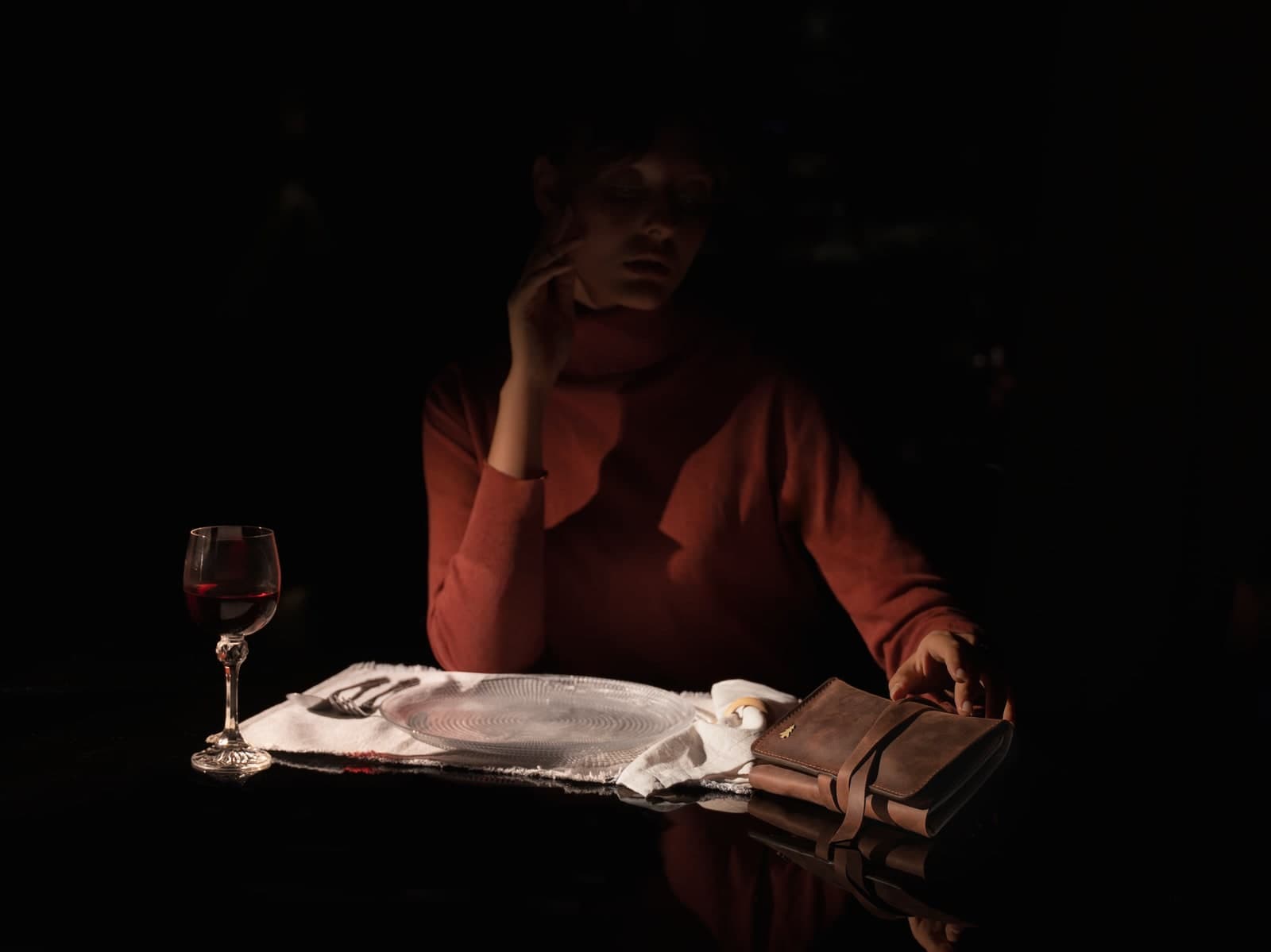 ARAS PINE Padrone Pipe Case — brown, roll & tie — Rolled and tied on a reflective dining table beside a glass of red wine — low-key, candle-lit, the atelier at dinner.