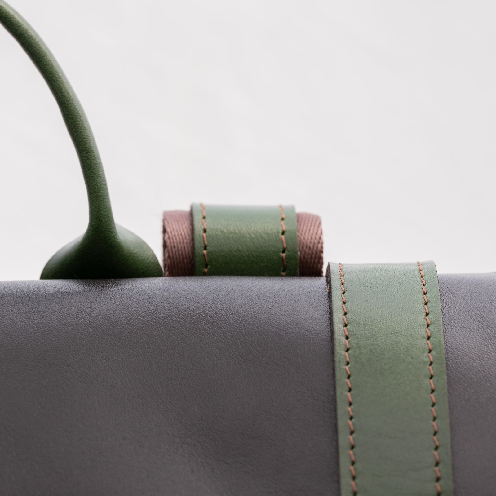 ARAS PINE Elvar Backpack — black & forest green rolltop, detail — leather backpack (close-up detail), handmade in Türkiye