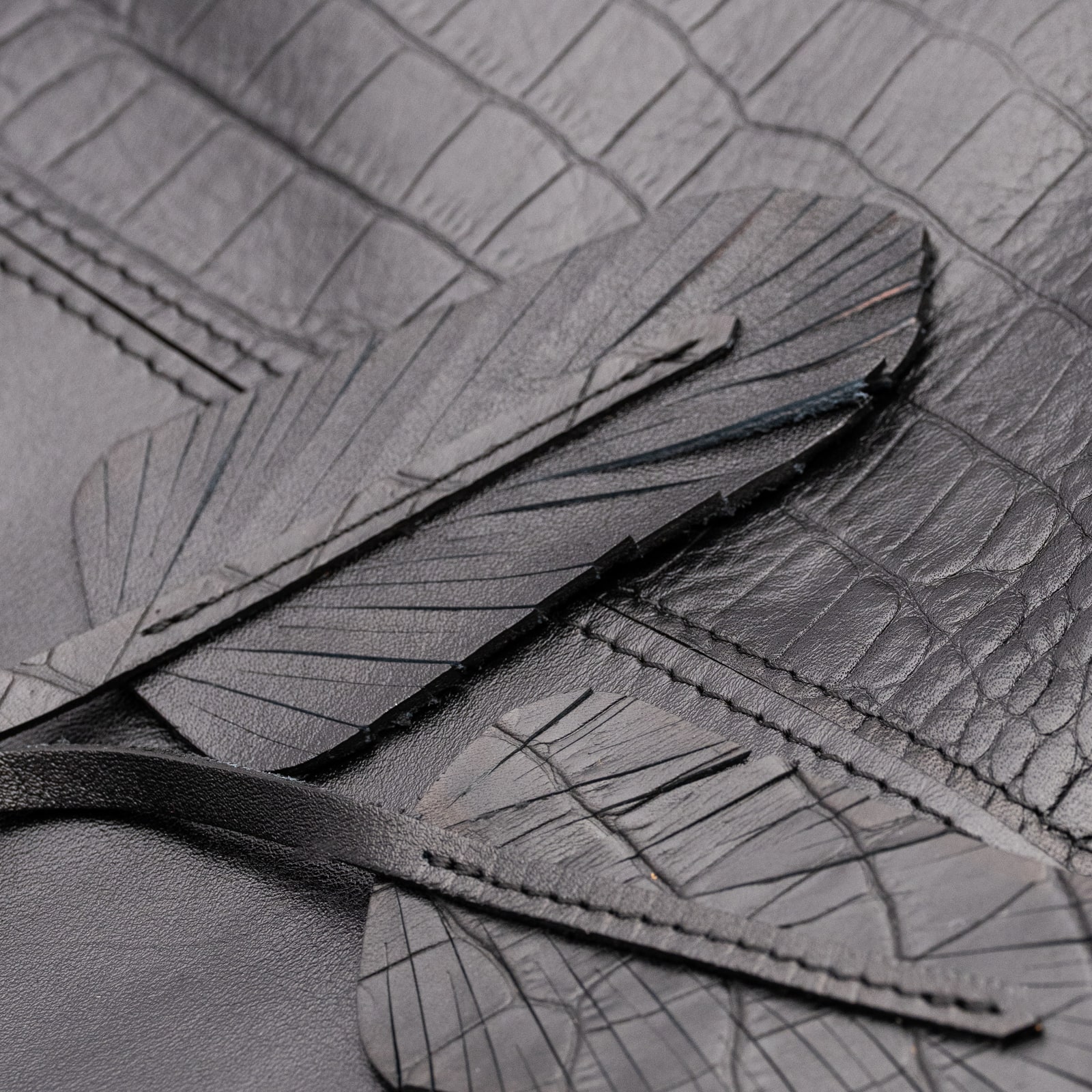 ARAS PINE Feather Backpack — black croc-embossed, detail — leather backpack (close-up detail), handmade in Türkiye