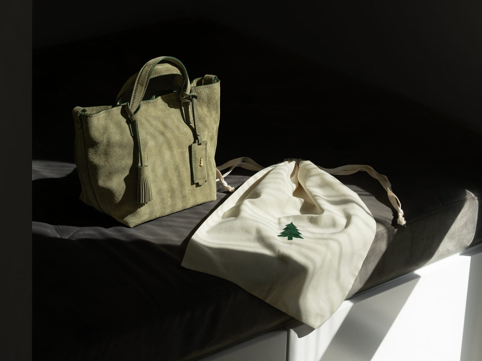 ARAS PINE Bellano Tote — suede tote beside its ARAS PINE branded dust bag in warm morning light — leather tote, handmade in Türkiye